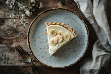 Delicious Slice of Banana Cream Pie on a Wooden Table