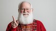 © Mandeep - cheerful elderly man with a white beard wearing a festive sweater