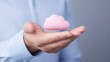 © A4719 - Cloud Computing Data Storage Digital Concept Hand Holding Pink Cloud