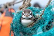 © typepng - The image of a penguin entangled in a plastic net symbolizes the challenges of marine plastic pollution and conservation efforts.