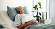 © peopleimages.com - Healthcare, recovery and thinking with old woman in hospital bed for medical treatment or wellness. Healing, medicine and relax with senior patient in clinic for comfort, medicare or rehabilitation