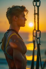 Wall Mural - a person enjoying the beautiful view of the ocean at sunset