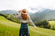 © maxbelchenko - Outdoor portrait of happy tourist admiring the landscape mountains nature. Travel, nature concept.