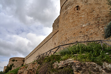 Medieval stone fortified tower and wall in Magliano in Tuscany