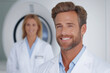 © Eugen - A cheerful radiologist smiling confidently with medical equipment in the background, symbolizing dedication to healthcare and advancements for Rare Disease Day or World Cancer Day