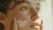 © Nikol R - Young girl applying cream on her face