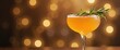 © Yury - Refreshing orange cocktail with rosemary garnish against warm bokeh background