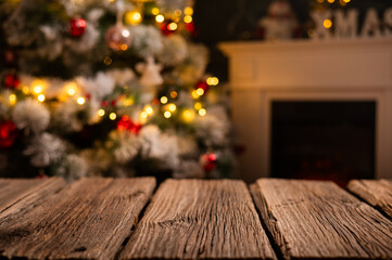 Wall Mural - wooden table and blurred Christmas tree in background