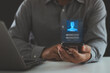 © THAWEERAT - Biometric Security System. Authentication by facial recognition concept. Digital connections, data protection. Businessman scan their face with a mobile smartphone to unlock and access personal data.