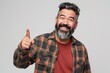 © Harsha - Happy Hispanic man with beard pointing and smiling at camera.