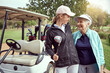 © peopleimages.com - Golf course, women and laugh on vacation with hug, bonding and sport together outdoor for fun. Grandmother, cart and game with club, fitness and family with health and wellness with love and golfer