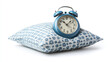 © Infinity Lens - Vintage retro classic rustic blue alarm clock or watch leaning on a pillow isolated on white background. morning early wake up time, snooze, tired.