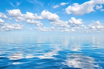 Wall Mural - calm blue ocean reflecting fluffy clouds