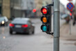 © ako-photography - traffic light on the street junction with beautiful bokeh, city with cars in the background