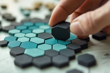 Poster - Hand placing hexagonal piece onto a honeycomb pattern.