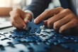 © rak - Close-up of a Hand Placing a Puzzle Piece