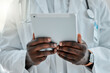 © peopleimages.com - Tablet, man and hands of surgeon in hospital for telehealth consultation and online medical report. Digital technology, research and male healthcare worker reading surgery or treatment plan in clinic