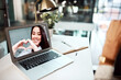 © peopleimages.com - Laptop screen, heart hands and woman on video conference call as communication, chat or conversation. Female person, technology and happiness for virtual meeting, discussion or connection with parent