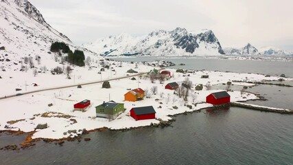 Canvas Print - 4K aerial - a bird's eye view video (Ultra High Definition) of Justad fishing village on Vestvagoy island, Norway. Colorful wooden houses on Lofoten Islands, traditional Norwegian architecture.