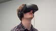 © Sunroft - Young man wearing VR headset, experiencing virtual reality.