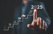© Nirusmee - 2025 New Year Business Goals Concept. Businessmen point to '2025' as a staircase, steps toward achieving business goals, growth, Planning and challenge, investor's target and success in the new year