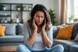 © Michael - Young Woman Experiencing Severe Menstrual Cramps in Living Room Focusing on Discomfort and Abdomen Pain