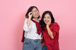 © PBXStudio - Cute Asian girl in red and white shirt and jeans posing with her friend in stylish outfits and smiling