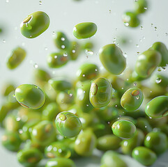 Canvas Print - A close-up of mung beans floating in the air on a white background, flat, without pods.