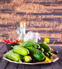 Wall Mural - Heap of fresh cucumbers on wooden background