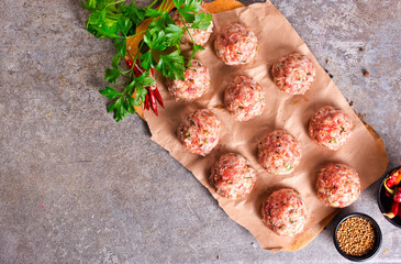 Canvas Print - Raw meatball over beton ready for cooking