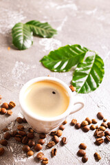 Poster - Coffee cup and beans on old kitchen table. Top view with copyspace for your text