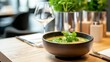 © Nutty - Freshly Prepared Bowl of Soup with Herbs on Wooden Table in Modern Restaurant Setting thai food