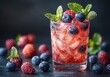 ©  Foring_Stock - Glass filled with chilled berry blast drink, ice, and fresh berries, offering a refreshing burst of summer flavor.