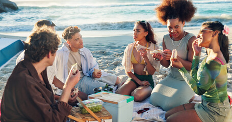 Wall Mural - Beach, picnic and group of people with lunch, sandwich and eating together on tropical holiday celebration. Friends, men and women relax at ocean with food, fun outdoor adventure and happy vacation