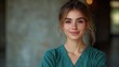 © Ta - A friendly medical doctor or nurse in green scrubs stands against a blank background
