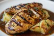 © VolumeThings - Herb and spice marinated chicken with demi glace sauce side of scalloped potatoes Tender chicken complements rich sauce and cheesy potatoes