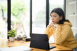 © Fahng - Asian girl student online learning class study online video call zoom teacher, Happy asian girl learn english language online with computer laptop.