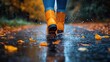© Ta - Rain boots splashing through puddles on a rainy autumn street