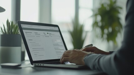 Aufkleber - A person typing on a laptop in a modern workspace with plants in the background.