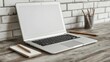 © michnik101 - Laptop, pencils in holder, and notebook on a rustic wooden desk with a white brick wall. Vintage workspace vibe