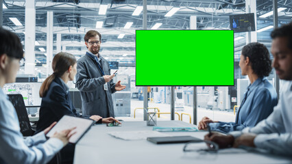 Poster - Electronics Factory Office Meeting: Caucasian Engineer Giving Presentation On TV With Green Screen Chromakey On Display. Diverse Colleagues Listening About Production Of Microchips, Taking Notes.