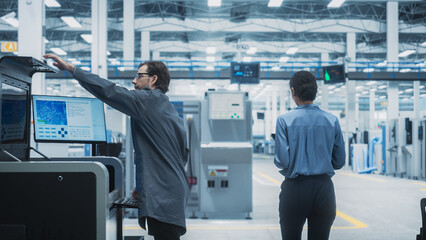 Poster - Caucasian Male Assembly Line Worker Using Soldering Jet Printer For Production Of Printed Circuit Boards At Autonomous Factory. Man Working On Computer Parts For High-Tech Machine Learning Systems.