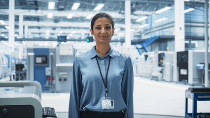 Aufkleber - Portrait of Hispanic Female Facility Technician Standing, Looking at Camera and Smiling. Young Industrial Specialist Working At an Autonomous Electronics Factory, Producing High Tech Devices.
