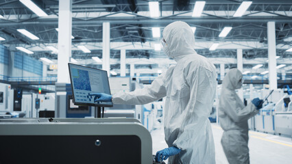 Fototapete - Printed Circuit Board Production In Electronics Factory Research Center: Scientist In Sterile Suit Using Soldering Jet Printer To Make Motherboards For Powerful CPUs. Hardware Manufacturing Facility.
