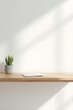 © fotoluigi868 - White office space features a real wood table top as its central focal point amidst a minimalist backdrop._00001_