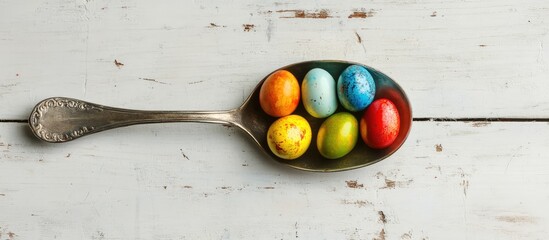 Fototapete - Vibrant Easter eggs arranged in a vintage spoon on a rustic white wooden backdrop perfect for holiday themed designs and decorations