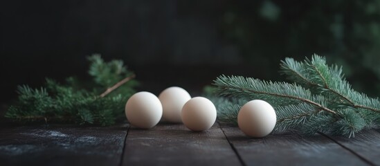 Poster - Elegant composition of fir branches and decorative white balls on a dark wooden surface for festive themed designs and backgrounds