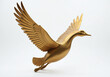 © Galeno - golden goose sculpture soars flight serene white backdrop representing wealth elegance prosperous