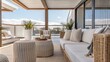 © DigitalSpace - A stylish outdoor patio featuring rattan sofas and side tables surrounded by low palm plants with soft throws for comfort perfect for enjoying the gentle breeze in a tropical