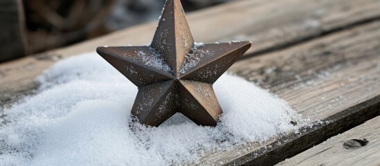 Poster - Vintage Christmas star toy resting on snow atop a rustic wooden surface evoking nostalgic holiday memories and seasonal charm.